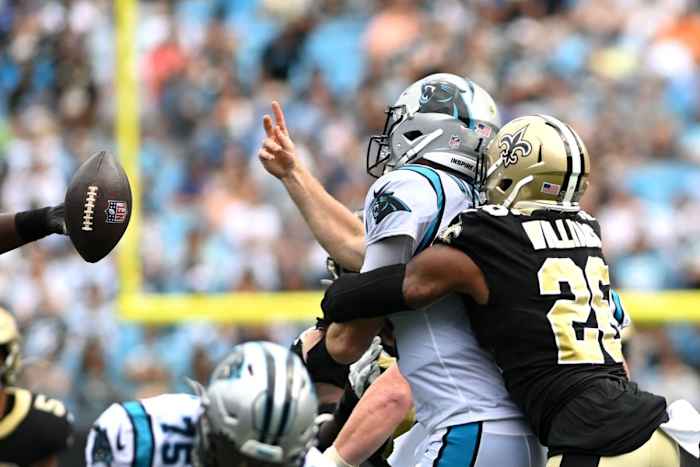 Carolina quarterback Sam Darnold (14) throws an interception as Saints cornerback P.J. Williams (26) pressures. Mandatory Credit: Bob Donnan-USA TODAY